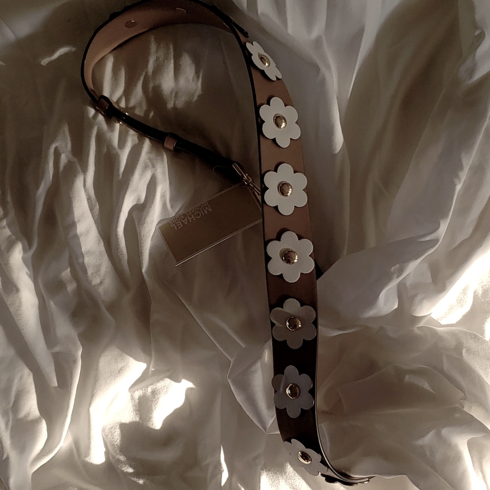 Michael Kors leather Guitar straps in Acorn and white with gold hardware.